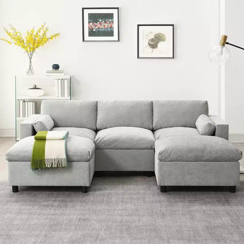 Canapé d'angle modulable 5 places Polibi en chenille avec deux poufs