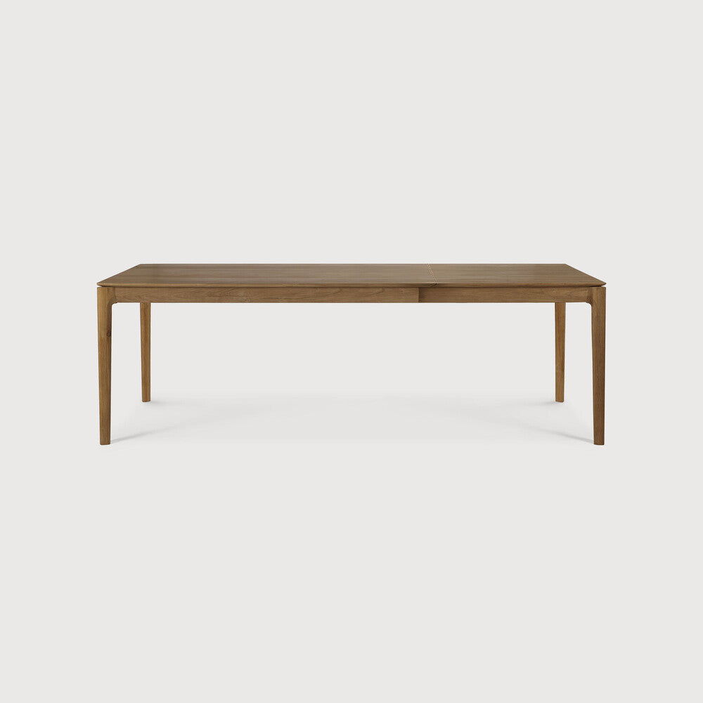 Table à manger extensible contemporaine en chêne massif avec plateau rectangulaire et piètement ajouré pour salle à manger