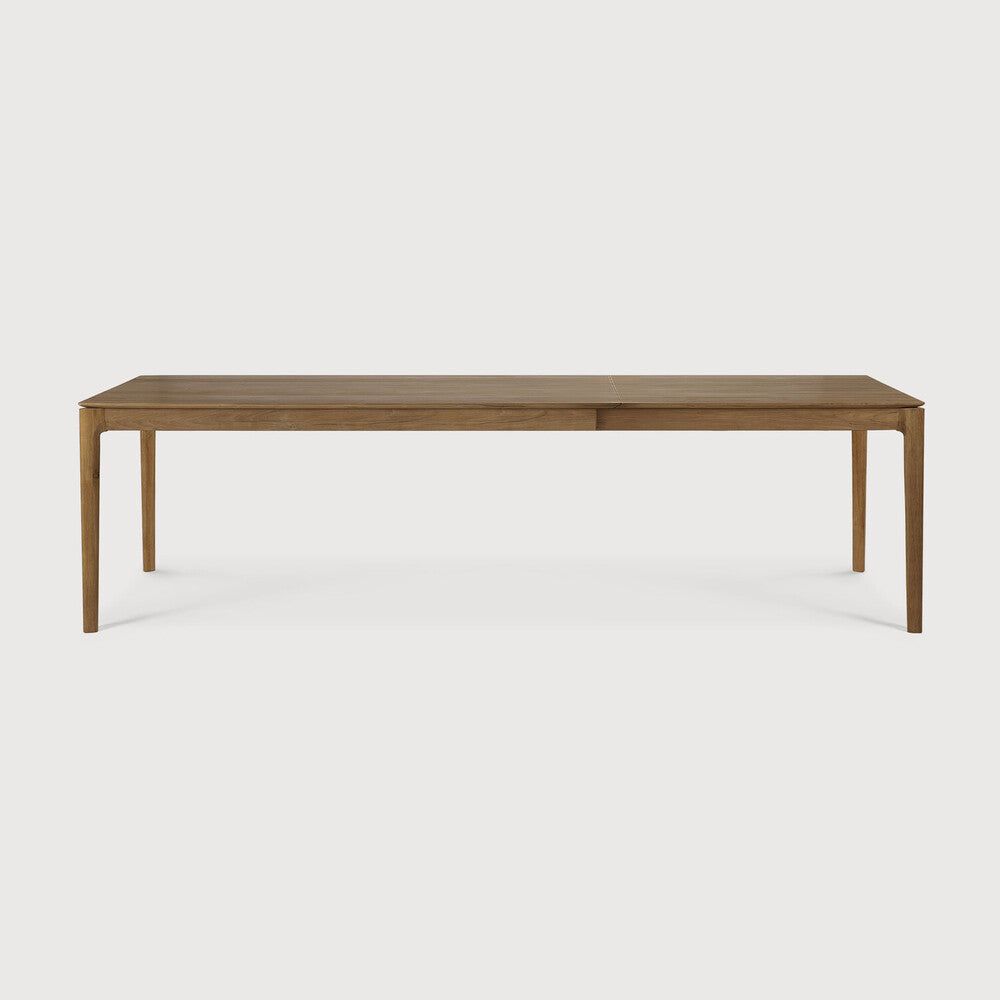 Table à manger extensible contemporaine en chêne massif avec plateau rectangulaire et piètement ajouré pour salle à manger