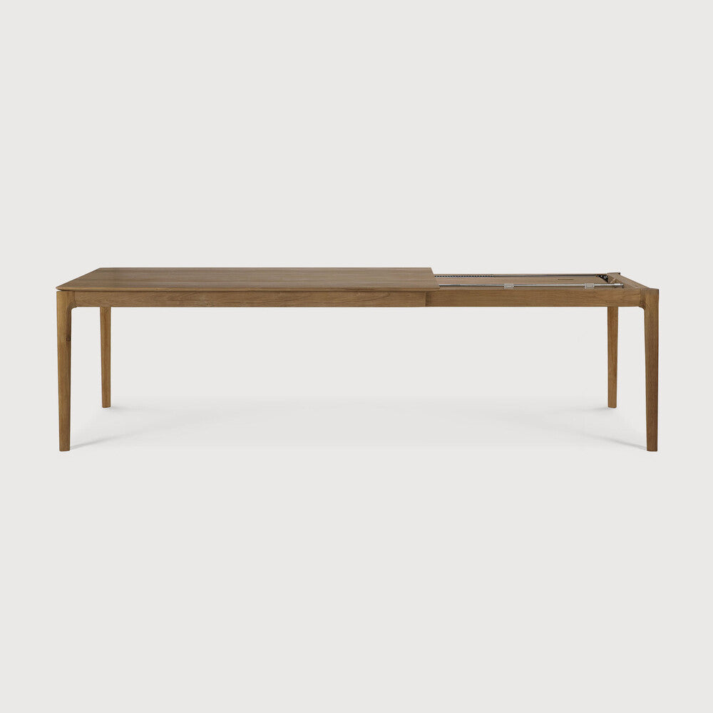 Table à manger extensible contemporaine en chêne massif avec plateau rectangulaire et piètement ajouré pour salle à manger