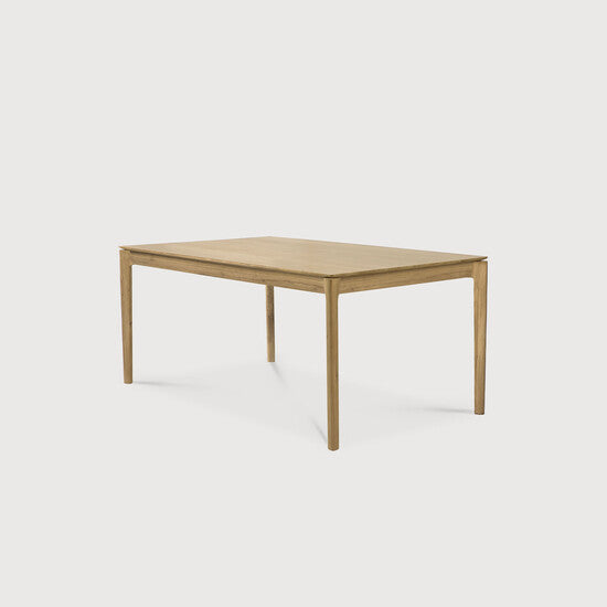 Table à manger extensible contemporaine en chêne massif avec plateau rectangulaire et piètement ajouré pour salle à manger