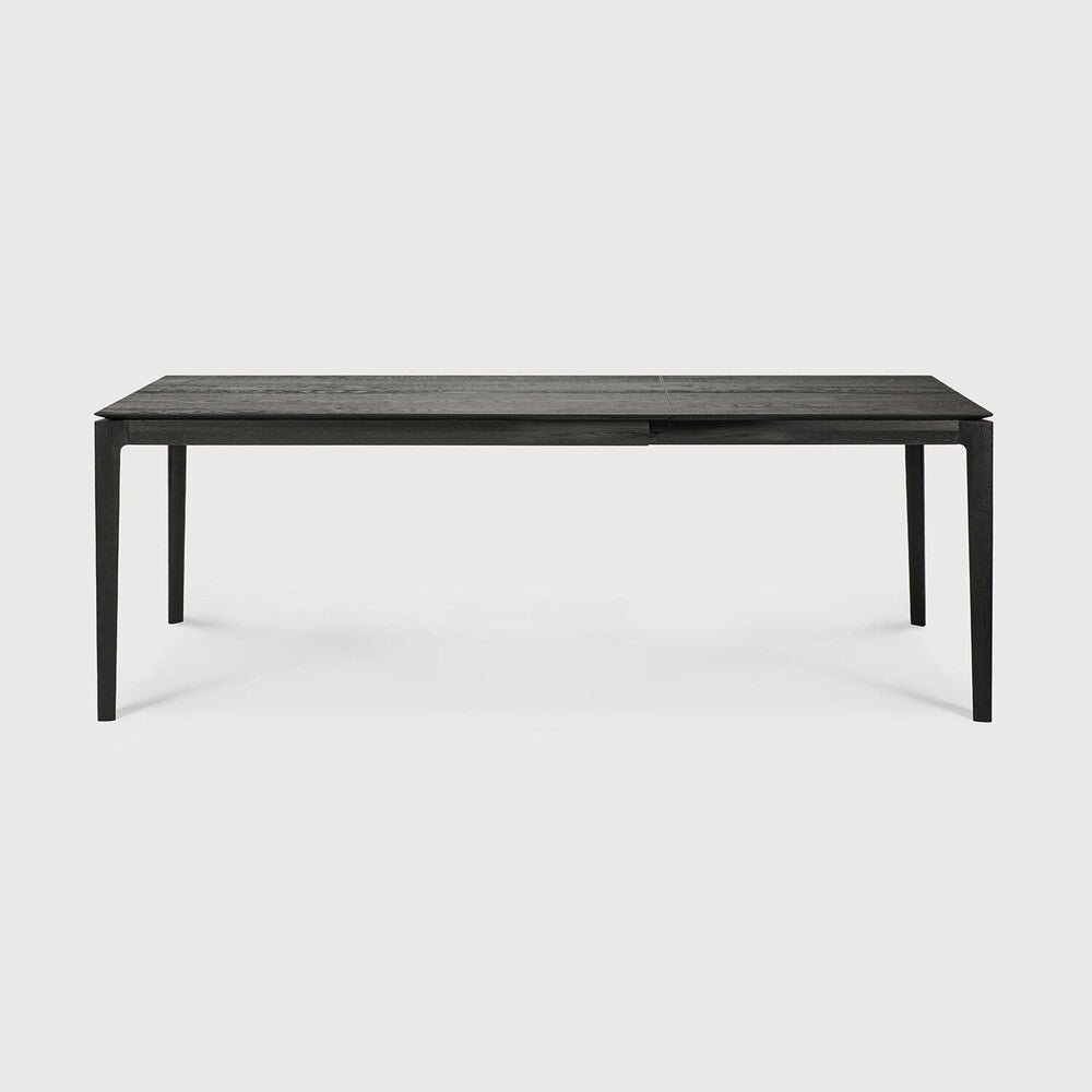 Table à manger extensible contemporaine en chêne massif avec plateau rectangulaire et piètement ajouré pour salle à manger