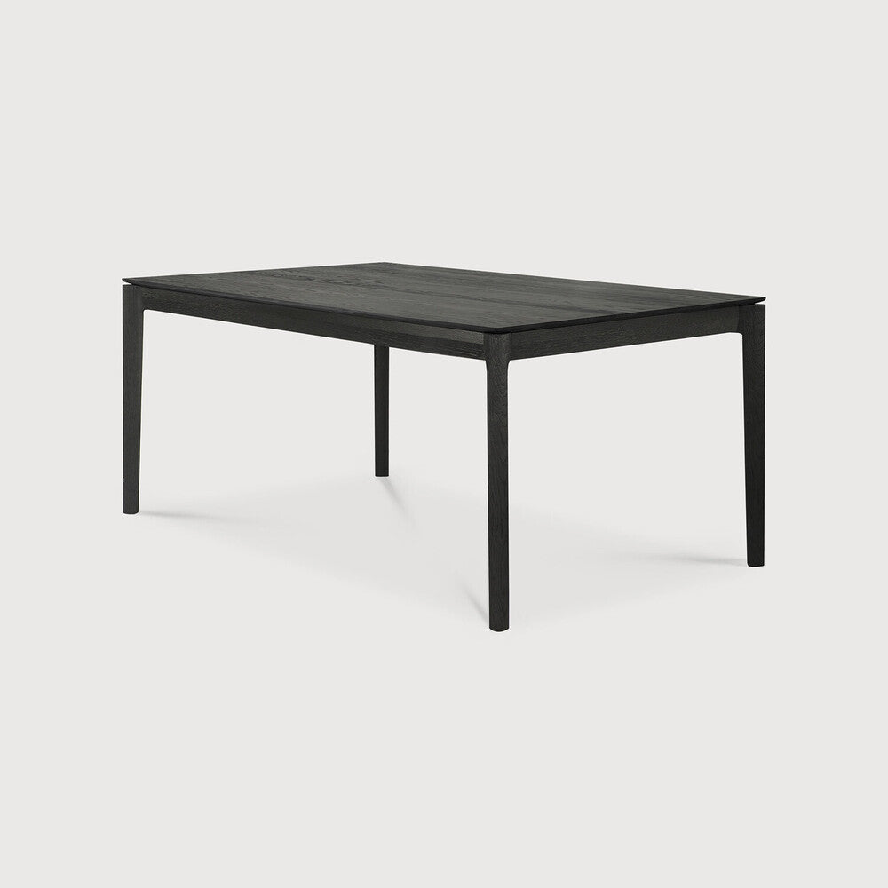 Table à manger extensible contemporaine en chêne massif avec plateau rectangulaire et piètement ajouré pour salle à manger