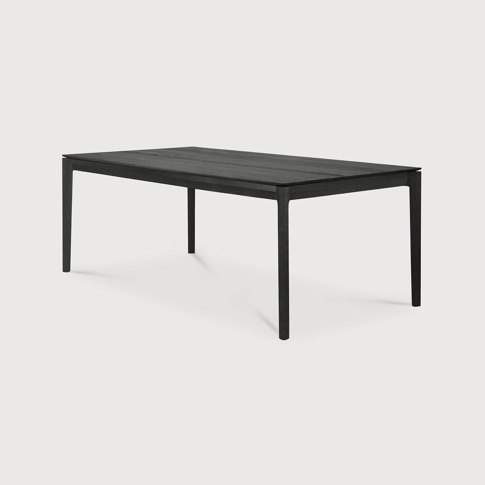 Table à manger extensible contemporaine en chêne massif avec plateau rectangulaire et piètement ajouré pour salle à manger