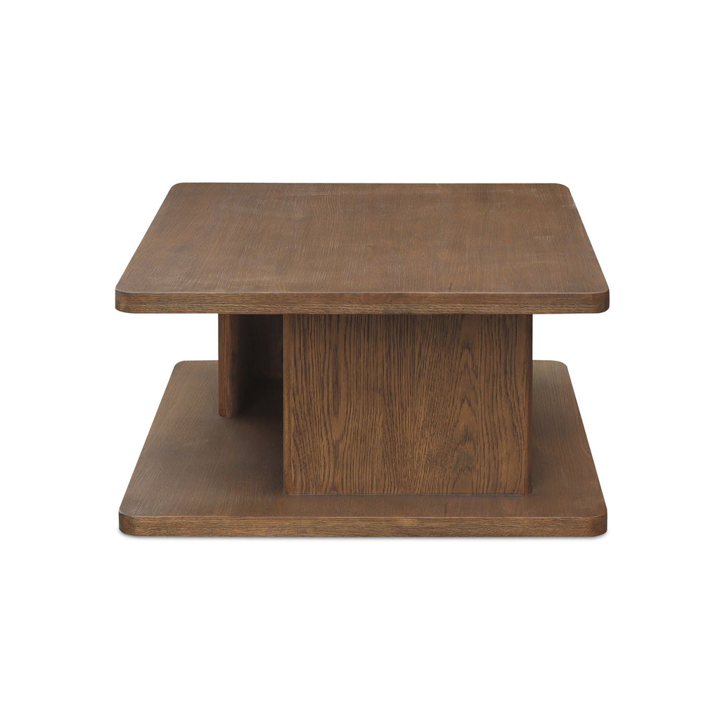 Table basse moderne en chêne massif avec plateau rond à rainure en V et piètement entretoisé en croisillon pour salon