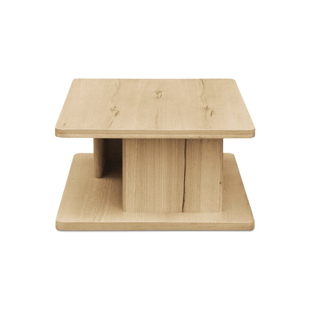 Table basse moderne en chêne massif avec plateau rond à rainure en V et piètement entretoisé en croisillon pour salon