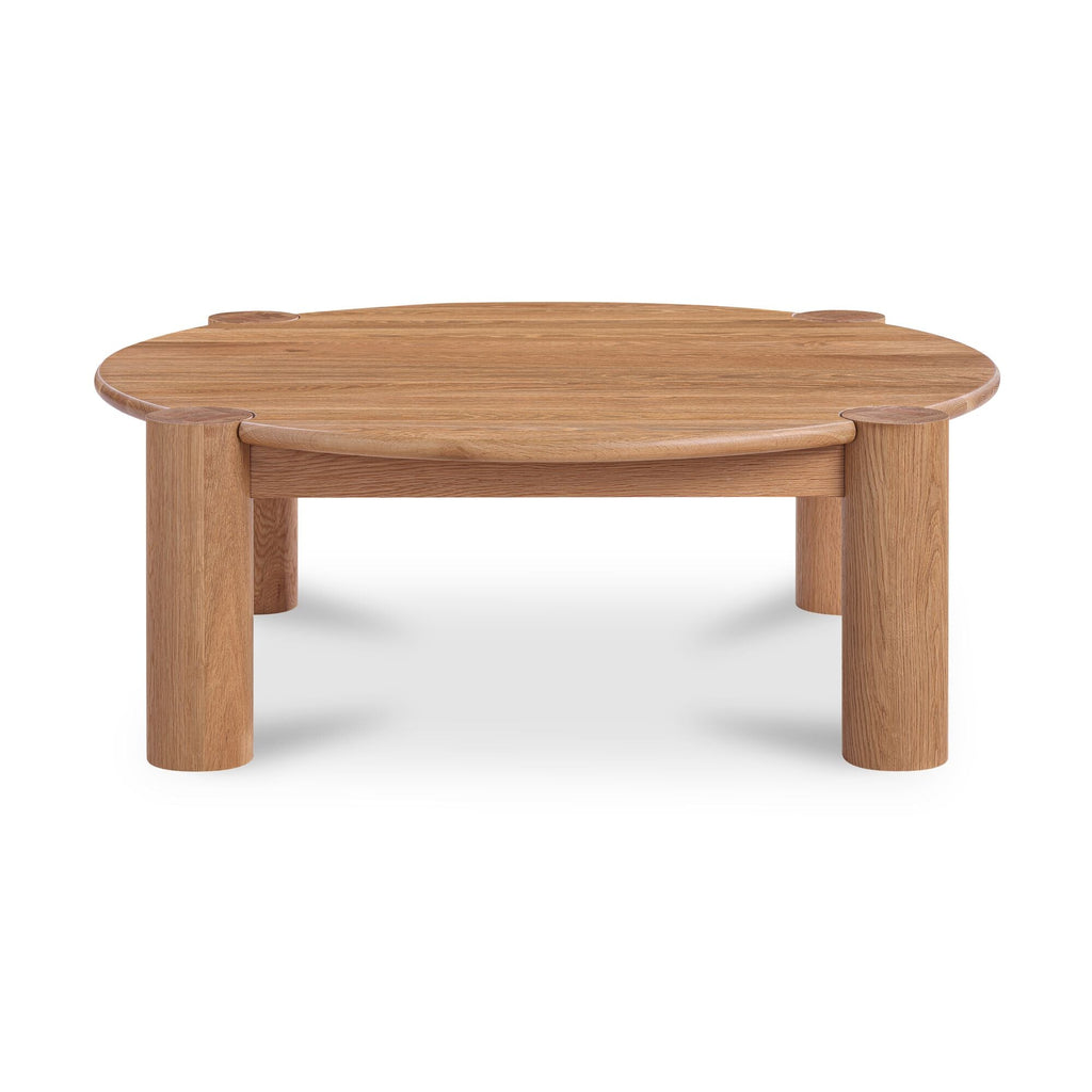 Table basse organique moderne en chêne massif avec plateau rond à bord arrondi et pieds colonne pour salon