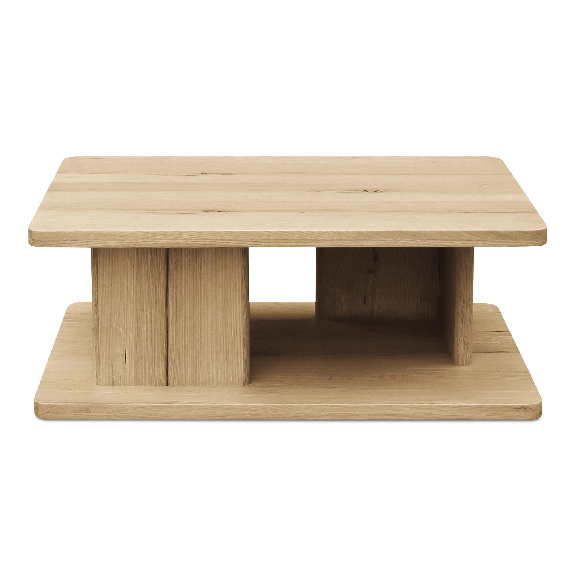 Table basse moderne en chêne massif avec plateau rond à rainure en V et piètement entretoisé en croisillon pour salon