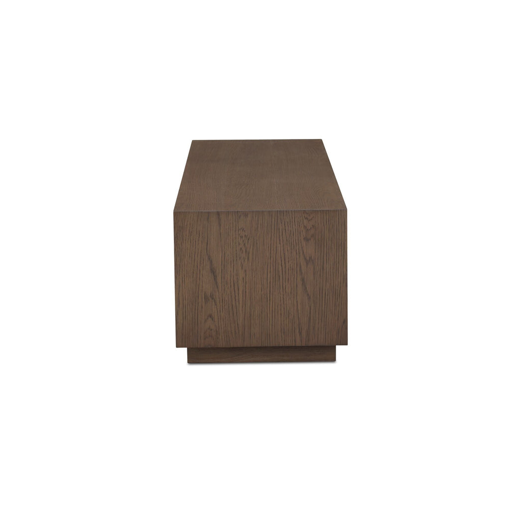 Table basse minimaliste en chêne avec plateau rectangulaire étroit et base en retrait pour salon