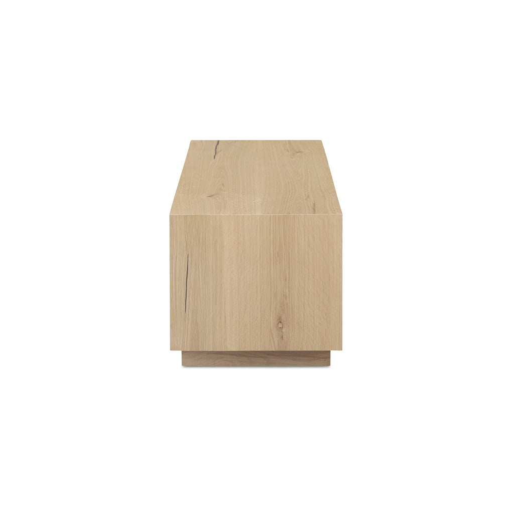 Table basse minimaliste en chêne avec plateau rectangulaire étroit et base en retrait pour salon