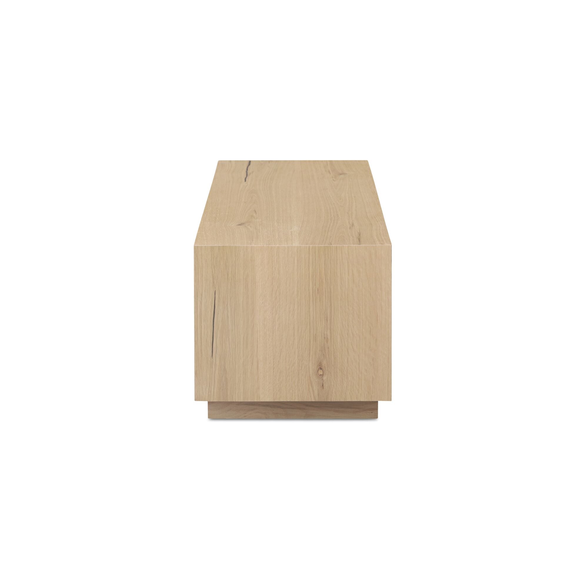 Table basse minimaliste en chêne avec plateau rectangulaire étroit et base en retrait pour salon
