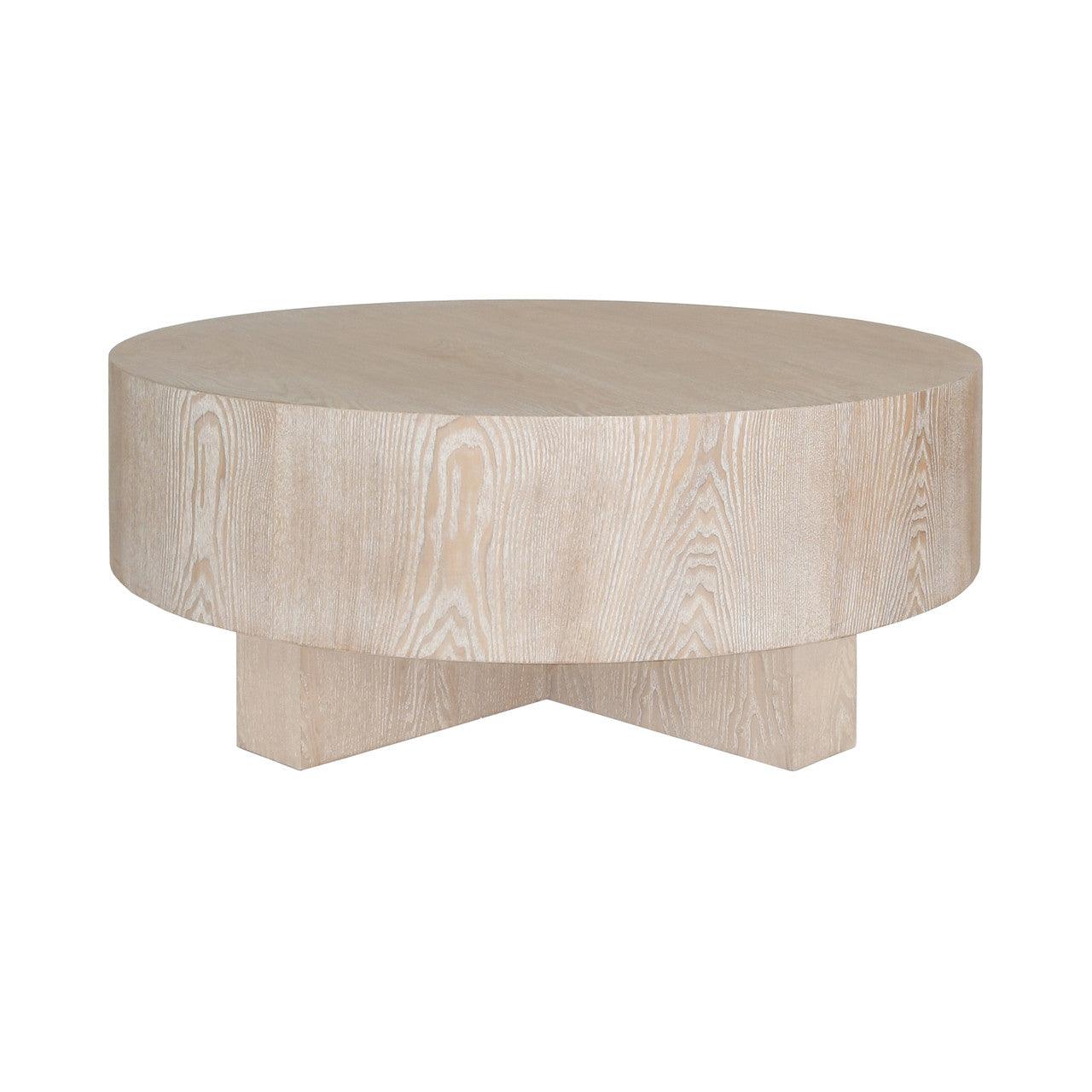 Table basse scandinave en chêne cérusé avec plateau rond épais et piètement en croix pour le salon