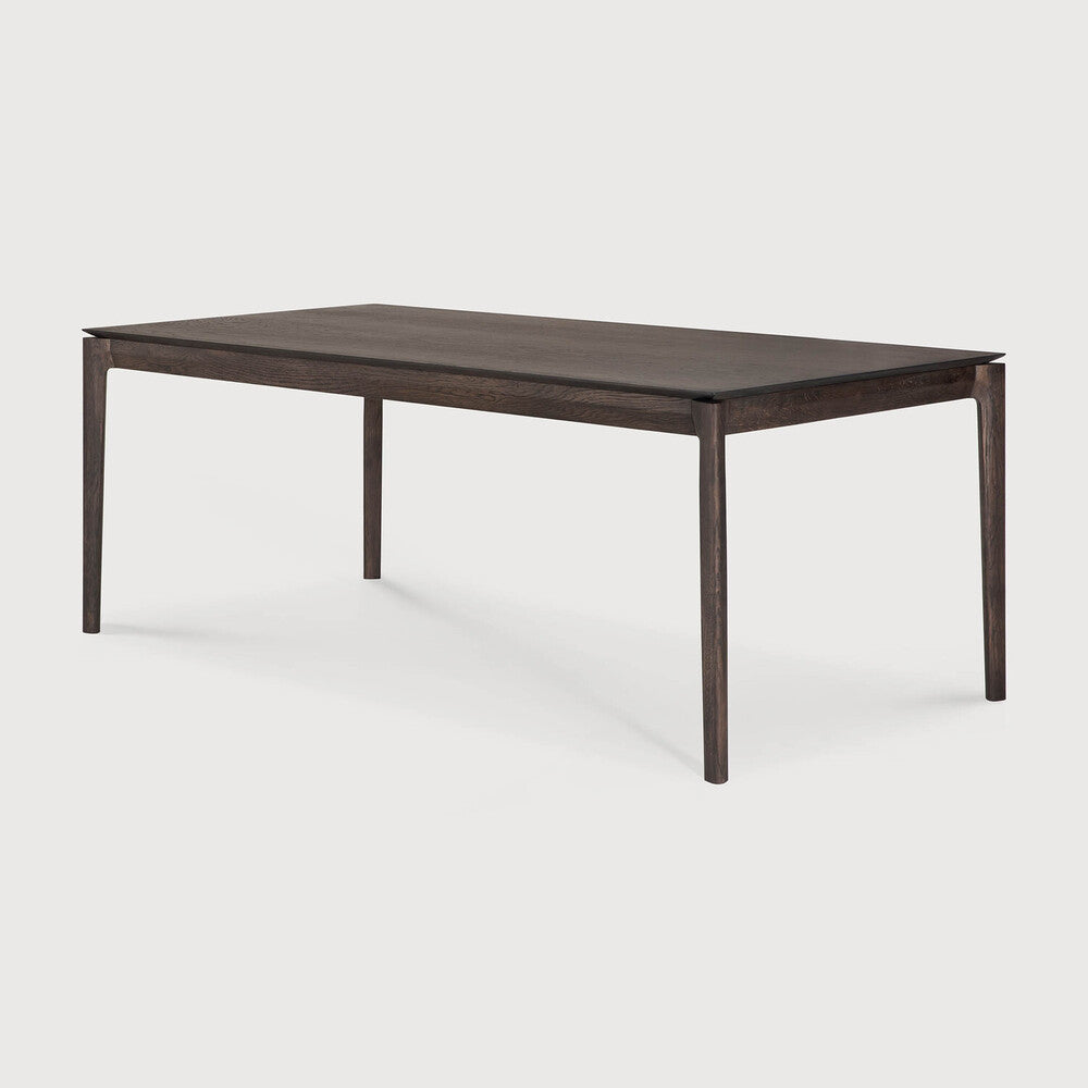 Table à manger extensible contemporaine en chêne massif avec plateau rectangulaire et piètement ajouré pour salle à manger