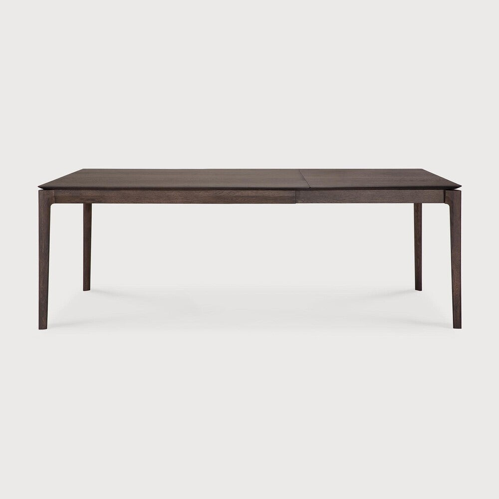 Table à manger extensible contemporaine en chêne massif avec plateau rectangulaire et piètement ajouré pour salle à manger