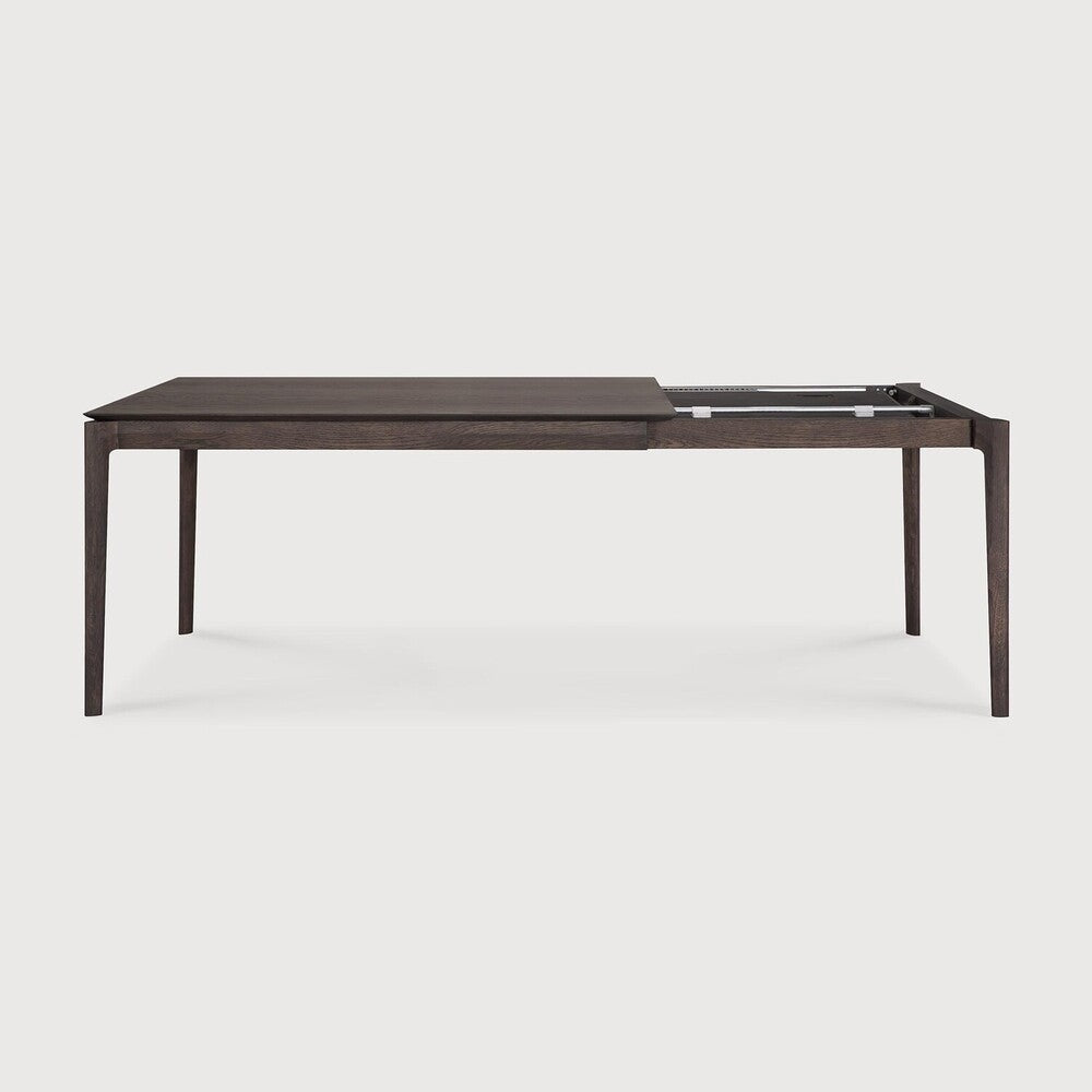 Table à manger extensible contemporaine en chêne massif avec plateau rectangulaire et piètement ajouré pour salle à manger