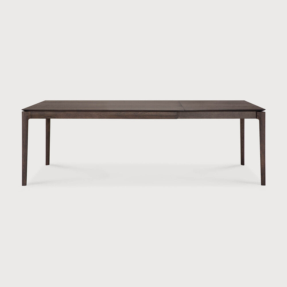 Table à manger extensible contemporaine en chêne massif avec plateau rectangulaire et piètement ajouré pour salle à manger
